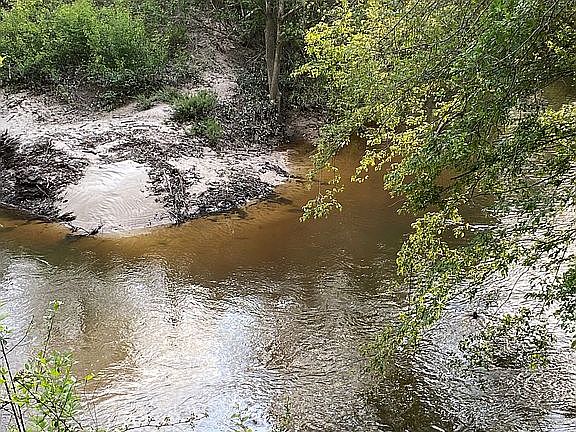 To the left of property 