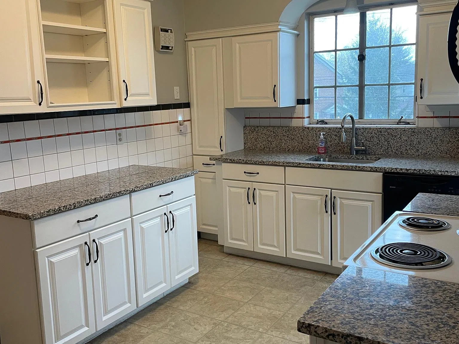 Updated large kitchen features plenty of storage and workspace