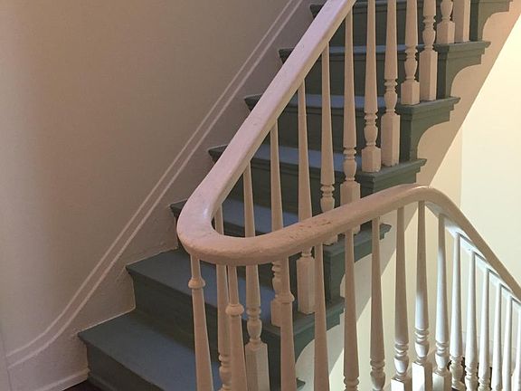 Historic staircase with original skylight for natural daylig