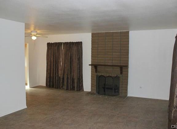 Formal dinning area and fireplace in living room