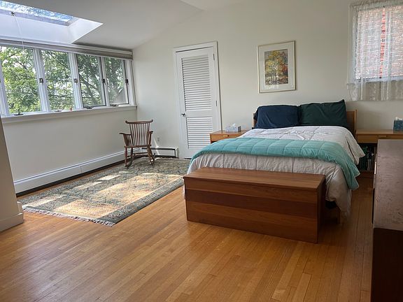 Queen bed, large wooden dresser and original artwork