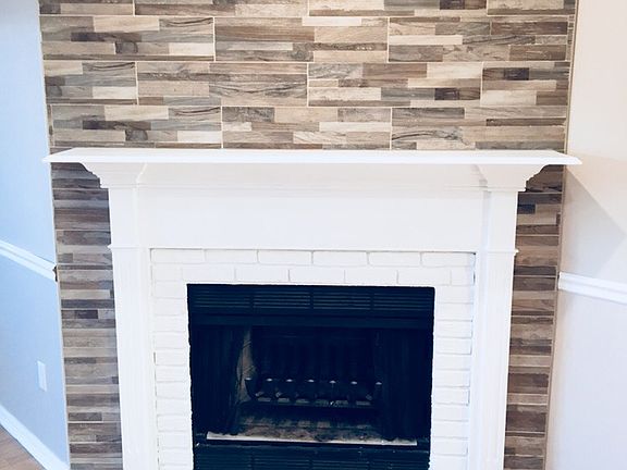 Fireplace & tiled wall