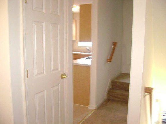 Hall to Kitchen, Half-Bath and Stairs to Bedrooms