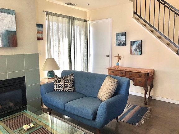Sliding glass doors on to balcony, large storage closet under stairs.