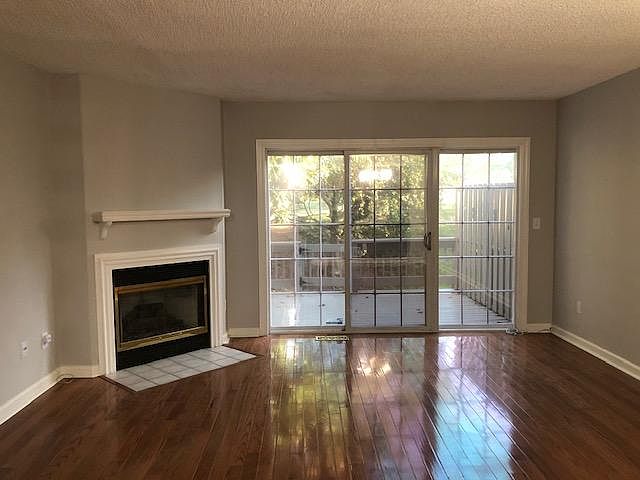 Living room with Fireplace, TV hookup and deck