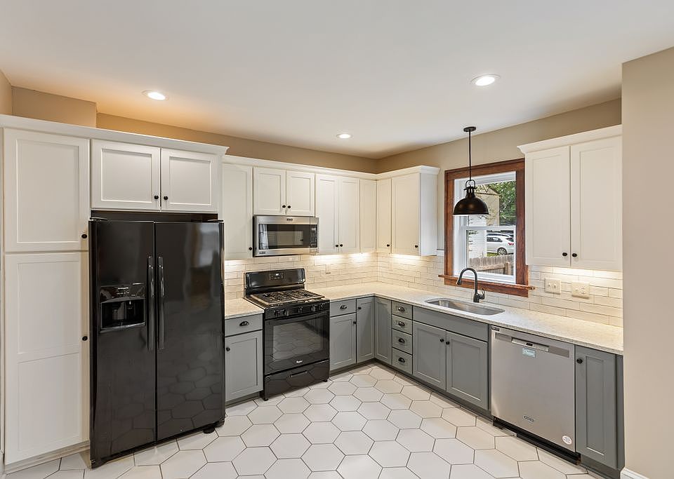 Open kitchen with lots of counter space and undercabinet lighting