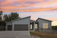 Front of house featuring three car garage
