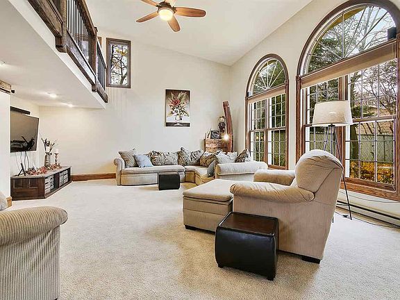 The two story family room is the size of some starter homes and features a loft and massive windows.