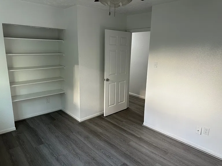 2nd bedrrom with fan extra shelving space