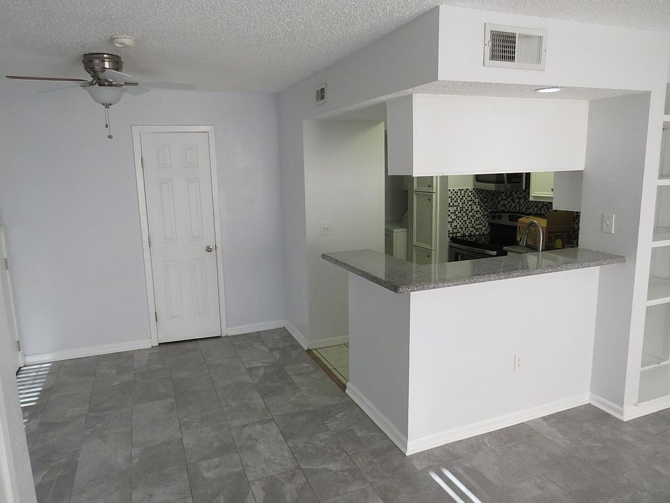 Updated tile floor in living room. Updated kitchen with granite countertops.