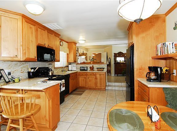 Spacious Kitchen with desk and bar