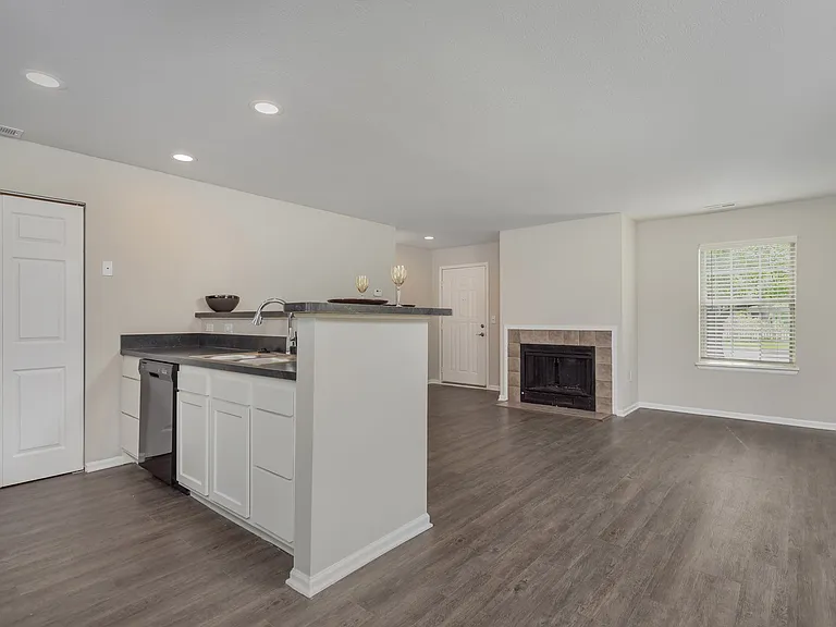 The Glenmount's Deluxe kitchen and living space features an open, inviting layout.