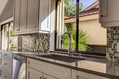 Stone backsplash and stainless sink