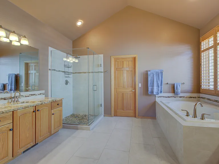 Gorgeous master bathroom with dual vanities and walk in closet.