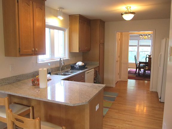 Main Kitchen w/ granite countertops and gourmet stainless steel sinks