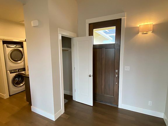 Front door (washer and dryer with barn door on the left). Coat closet on the left.