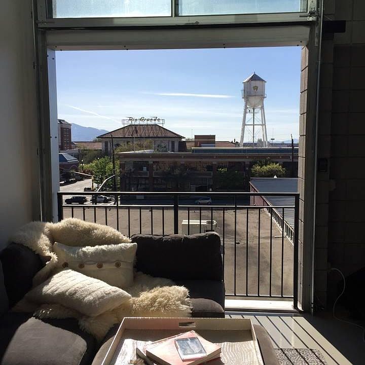 living room with garage door open.