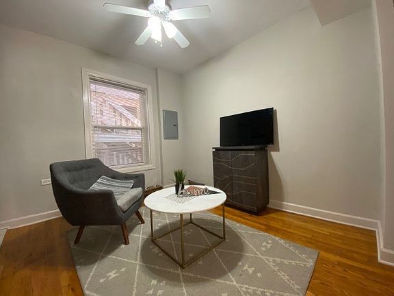 Living area with a ceiling fan