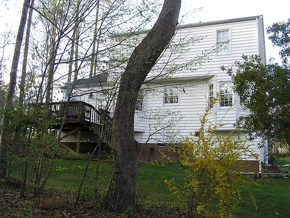 Private wooded backyard with deck