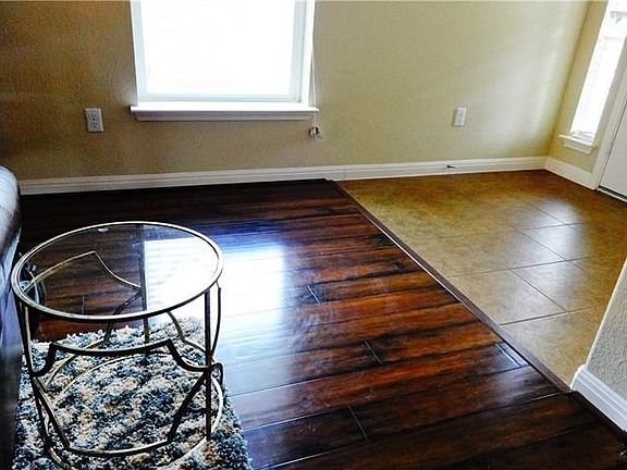 Tile Entry opens to the rich look of high quality vinyl wood plank floors in Living Room, Master and