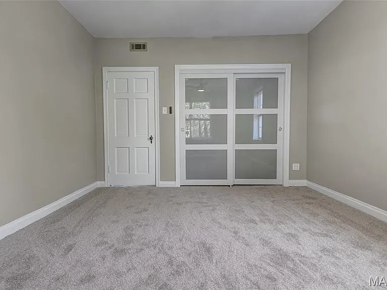 Lighted custom closets in both bedrooms.