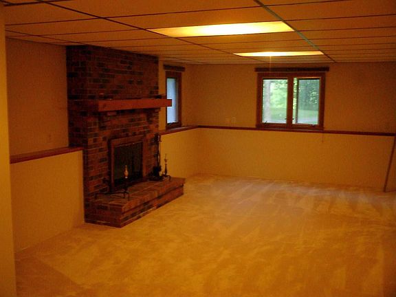 LL family room with new carpet in '09, & cozy up w/ wood fireplace all winter