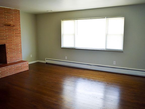 living room with wood burning fireplace