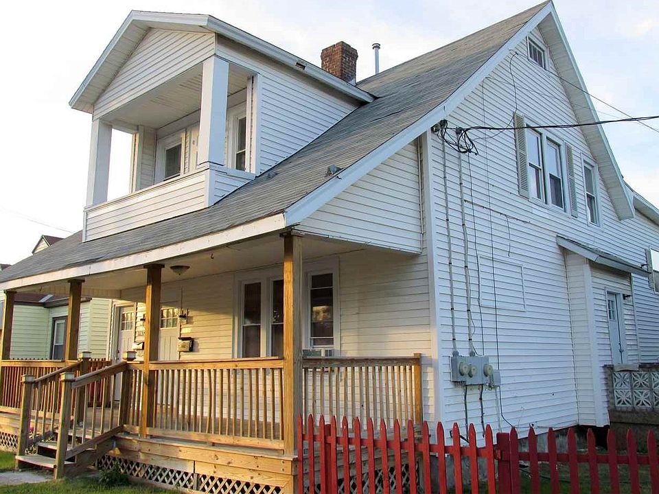 Two Family with 2 car garage, off street parking and fenced yard.