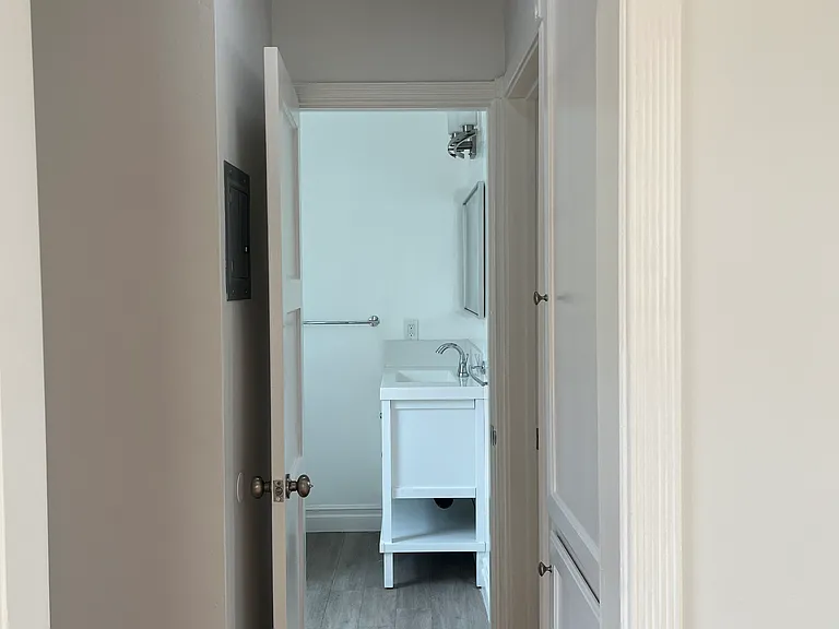 HALLWAY W/ ADDITIONAL LINEN CLOSET AND SPACE FOR STORAGE