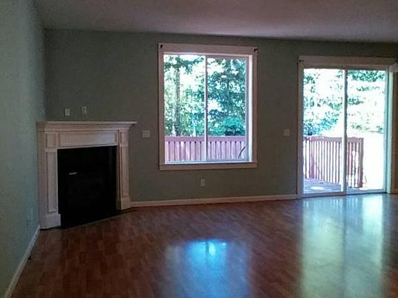 family room w/fireplace opens to deck
