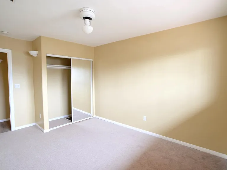 Front Bedroom w/closet and View of Front Yard