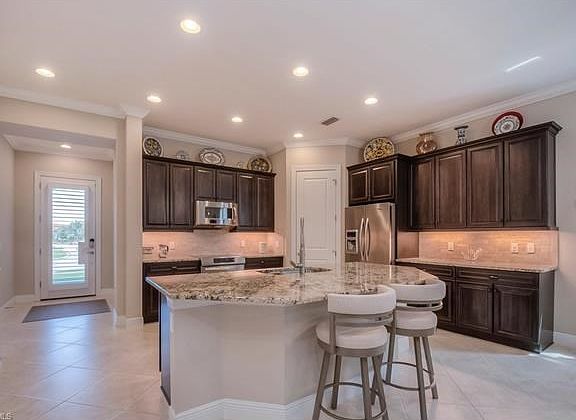 Under cabinet lighting & stainless steel appliances.