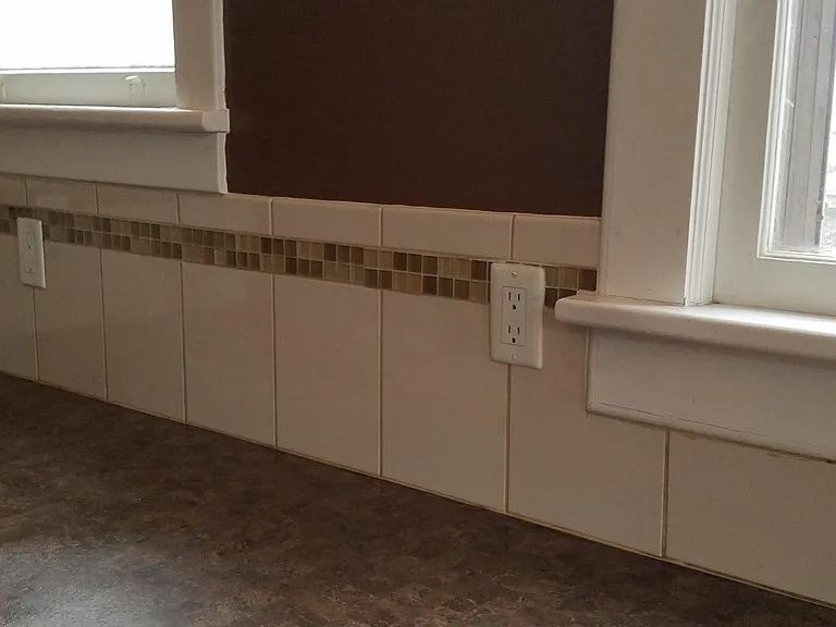 Tile work and GFI outlets in kitchen.