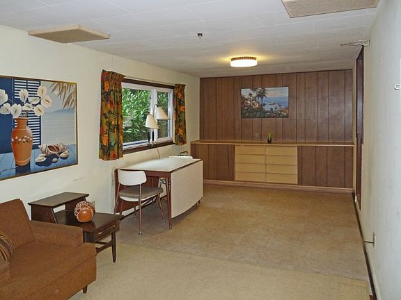 Years ago, this was an attached garage. Remodeled to a dining / family room with built in drawers and cabinet. Plenty of room to expand the table for large gatherings!