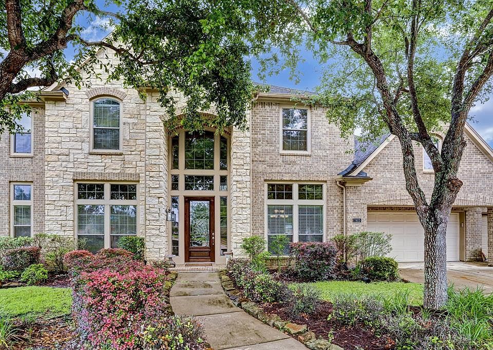 Stunning home on small tree lined cul de sac with huge lot and 4 CAR GARAGE. NO FLOODING.