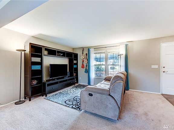 Living room, with the front door on the right.