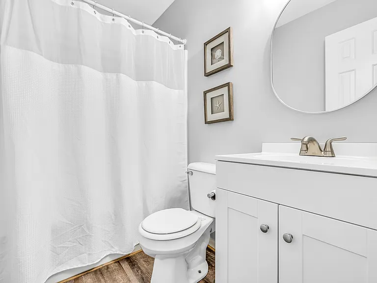 Guest bathroom with tub and shower
