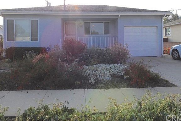 Charming home with extra large driveway for second car.