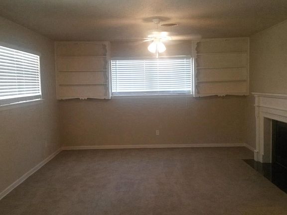 Two living areas, den has wood burning fireplace