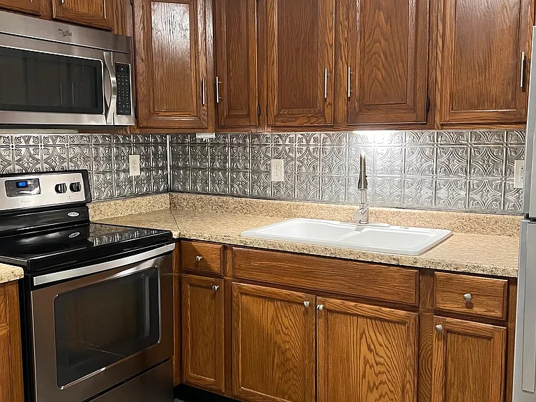 Kitchen with microwave and oven.