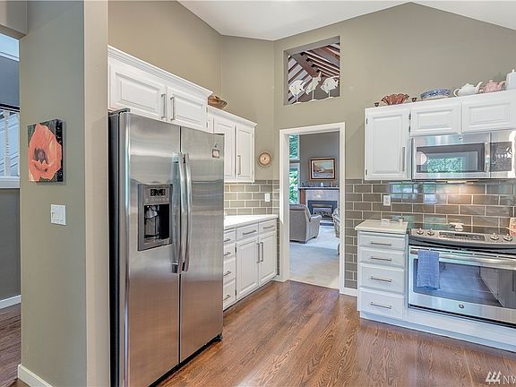 Gorgeous kitchen SS Appliances  with a space to have a table for breakfast. Owner uses it as a place for her computer.