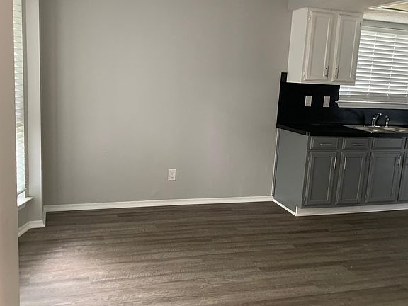 View upon entry of dining room, walking into galley kitchen