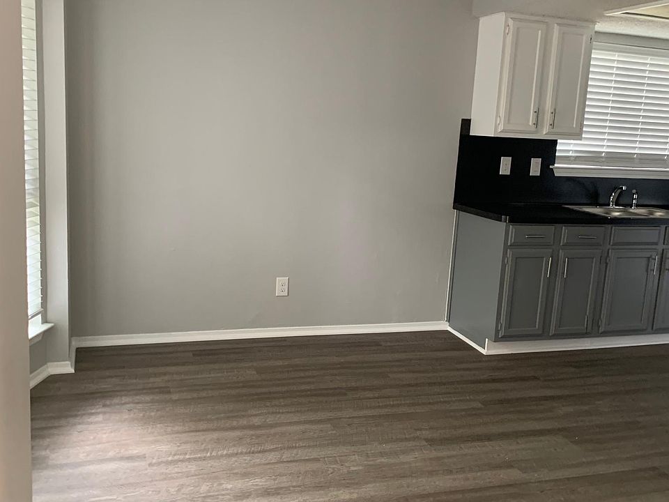 View upon entry of dining room, walking into galley kitchen