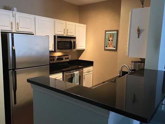 Fully applianced kitchen with granite counter tops