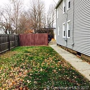 Side yard with privacy fenc...