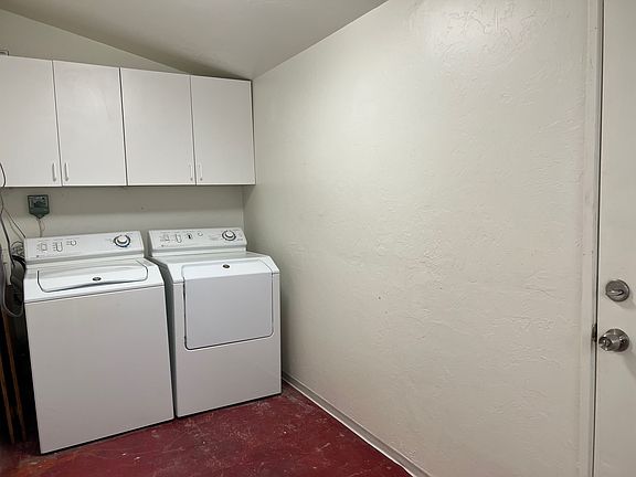 large laundry room with lots of storage space