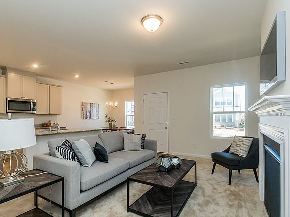 The open-concept floorplan allows for an easy flow between the living, dining and kitchen areas.