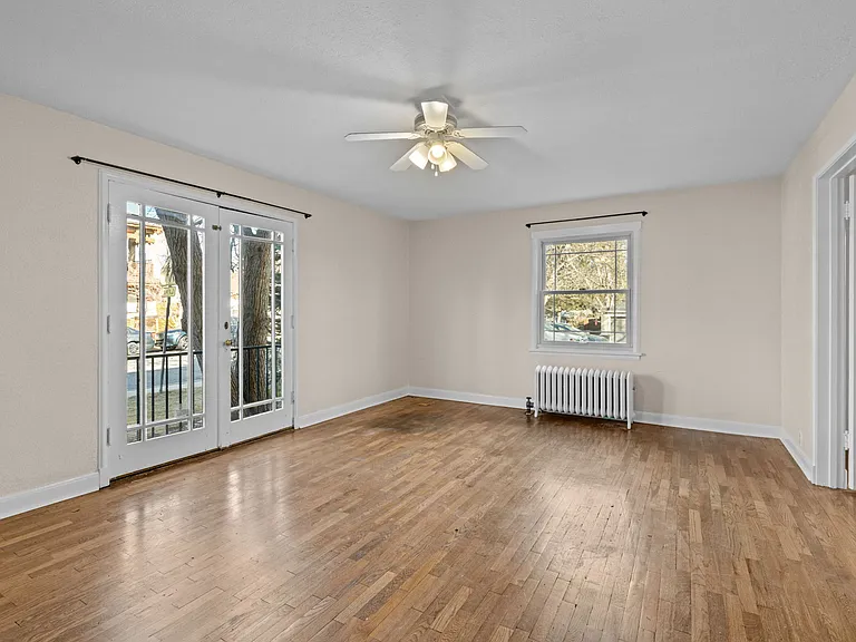 Living Room with French double doors opening in bedroom
