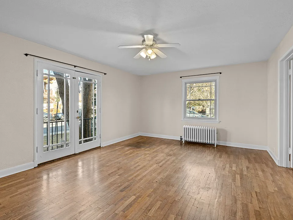 Living Room with French double doors opening in bedroom