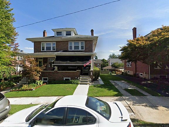Front of the home and off-street parking, next to the house, large enough for 2 vehicles.